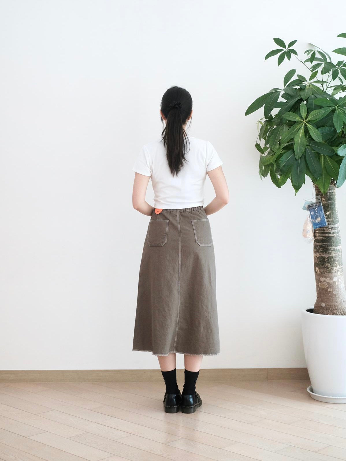 Moci 鈕扣中長扯布裙
